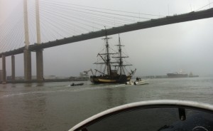 Tall Ship under Dartford bridge on Thames with rib